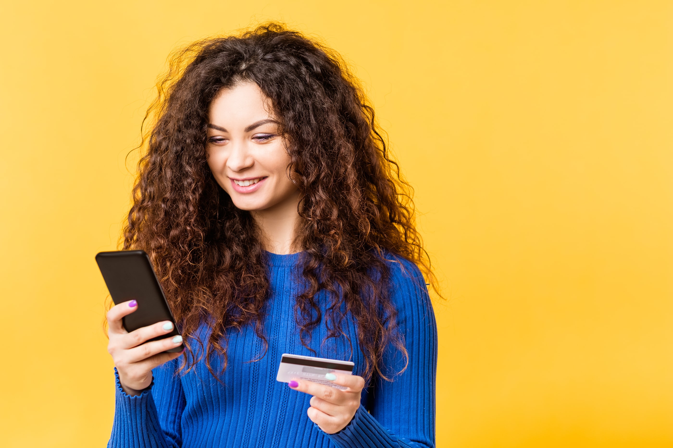 A young woman monitoring the balance of her checking account