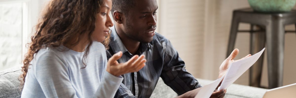 Black couple discussing finances